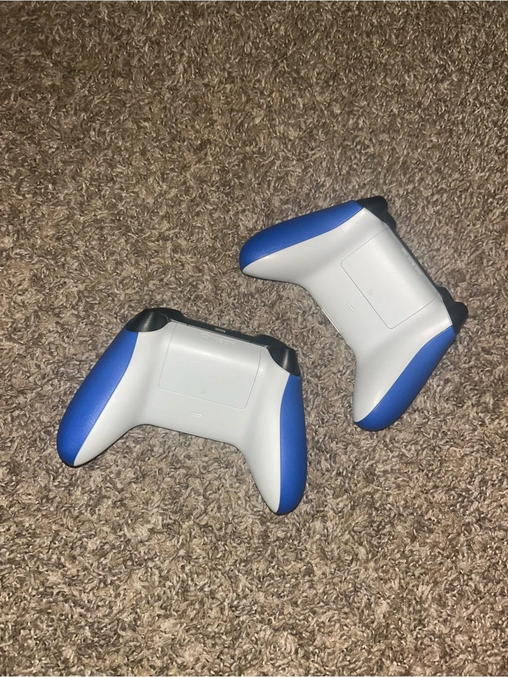 Two Blue Xbox Wireless Controllers